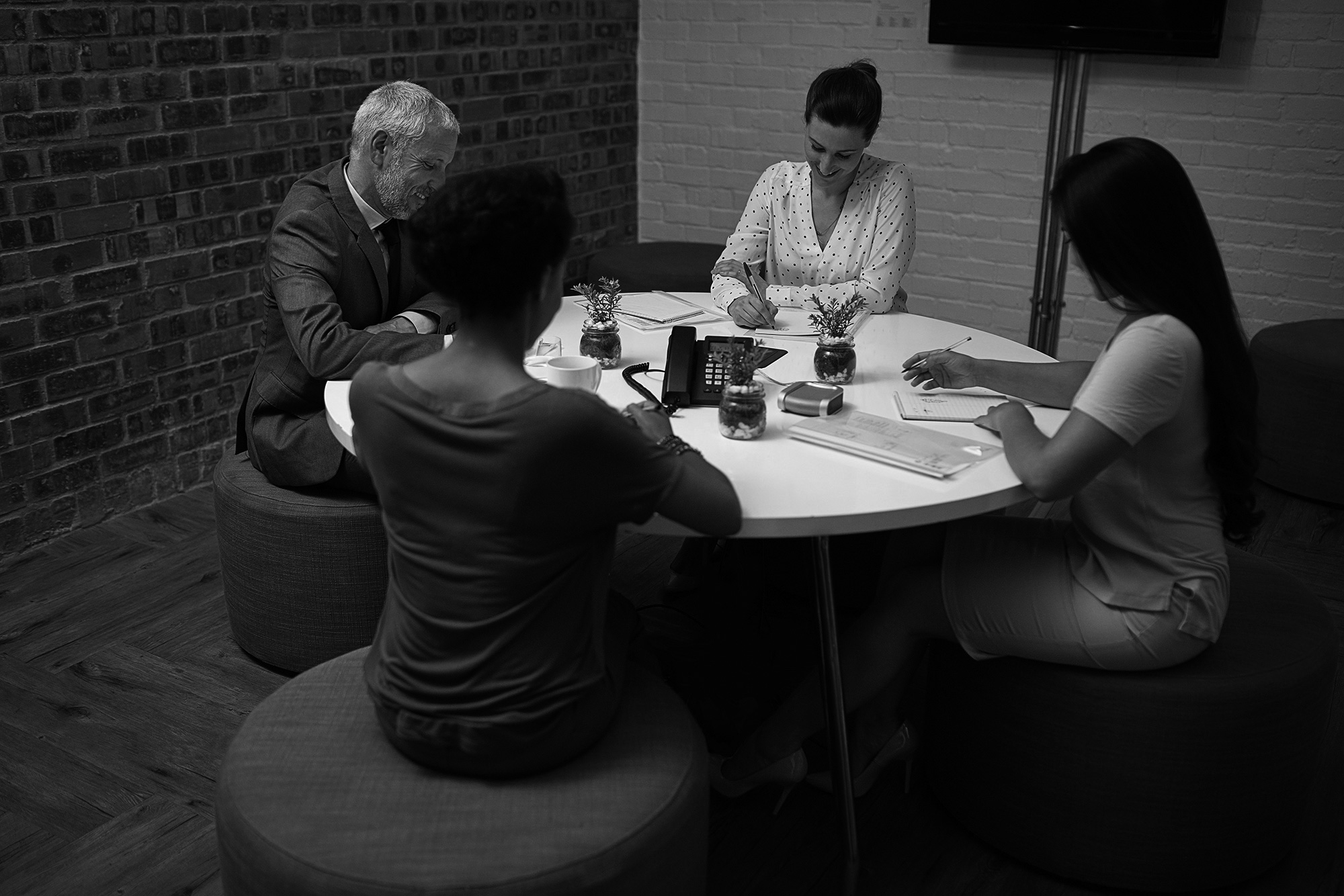 marketing-meeting-over-coffee-grey